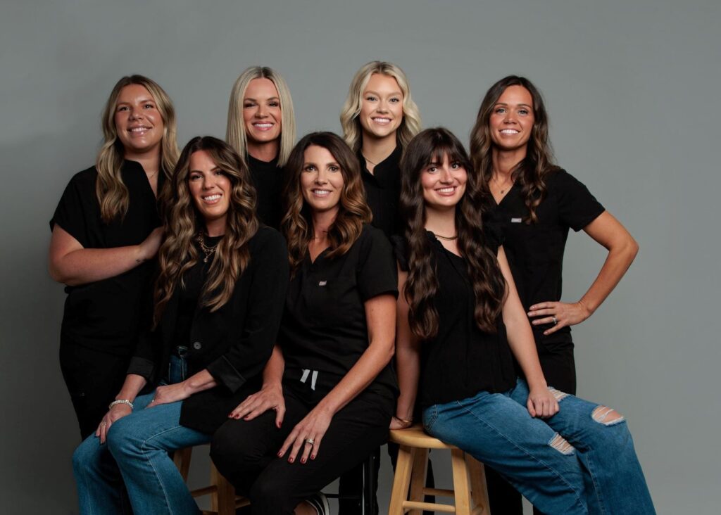 The staff of Evolve Medical Aesthetics + Wellness poses for a photo, ready to answer any of your questions about NAD+ injections in Muncie, Indiana.